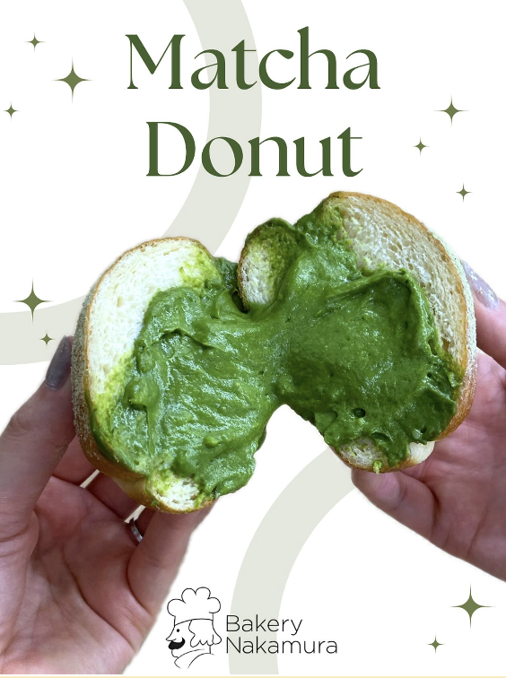Matcha cream-filled donut pulled apart to show green filling